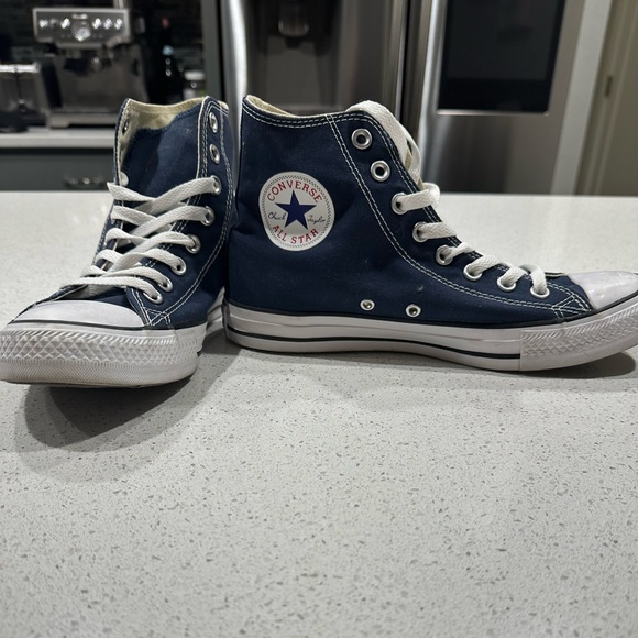 navy blue high top converse